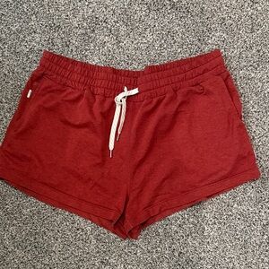 Vuori Women's Athletic Shorts in Rust Orange